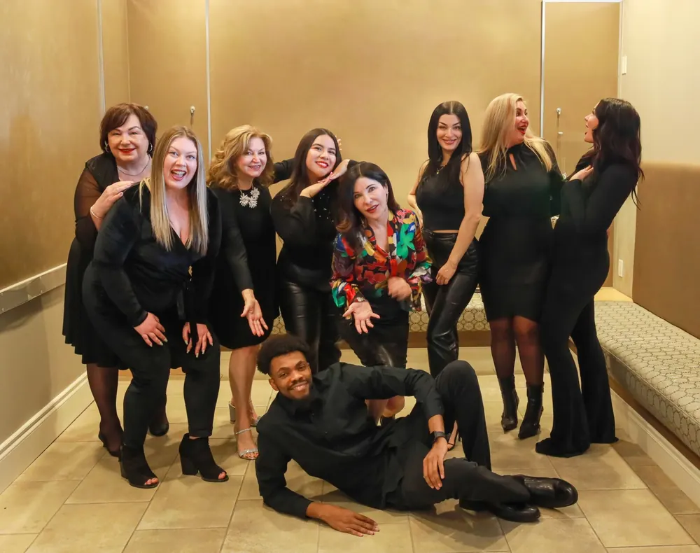 Dominic sharing a lighthearted behind-the-scenes moment with the AspireMD team during a shoot
